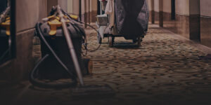 A wet/dry vac shown in a hallway in a hotel.