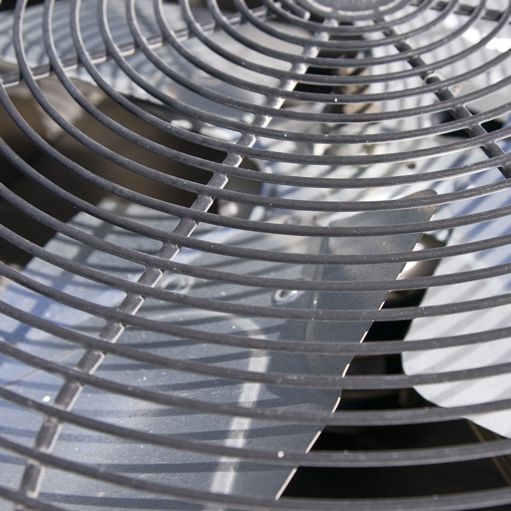 A close up of a metal air conditioning fan.