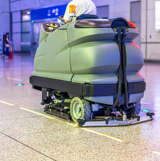 Ride-On Scrubber/Sweeper in an airport