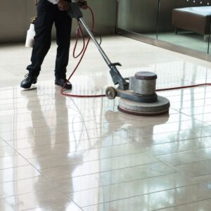 Man with floor burnisher