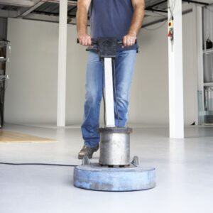 man waxing floor