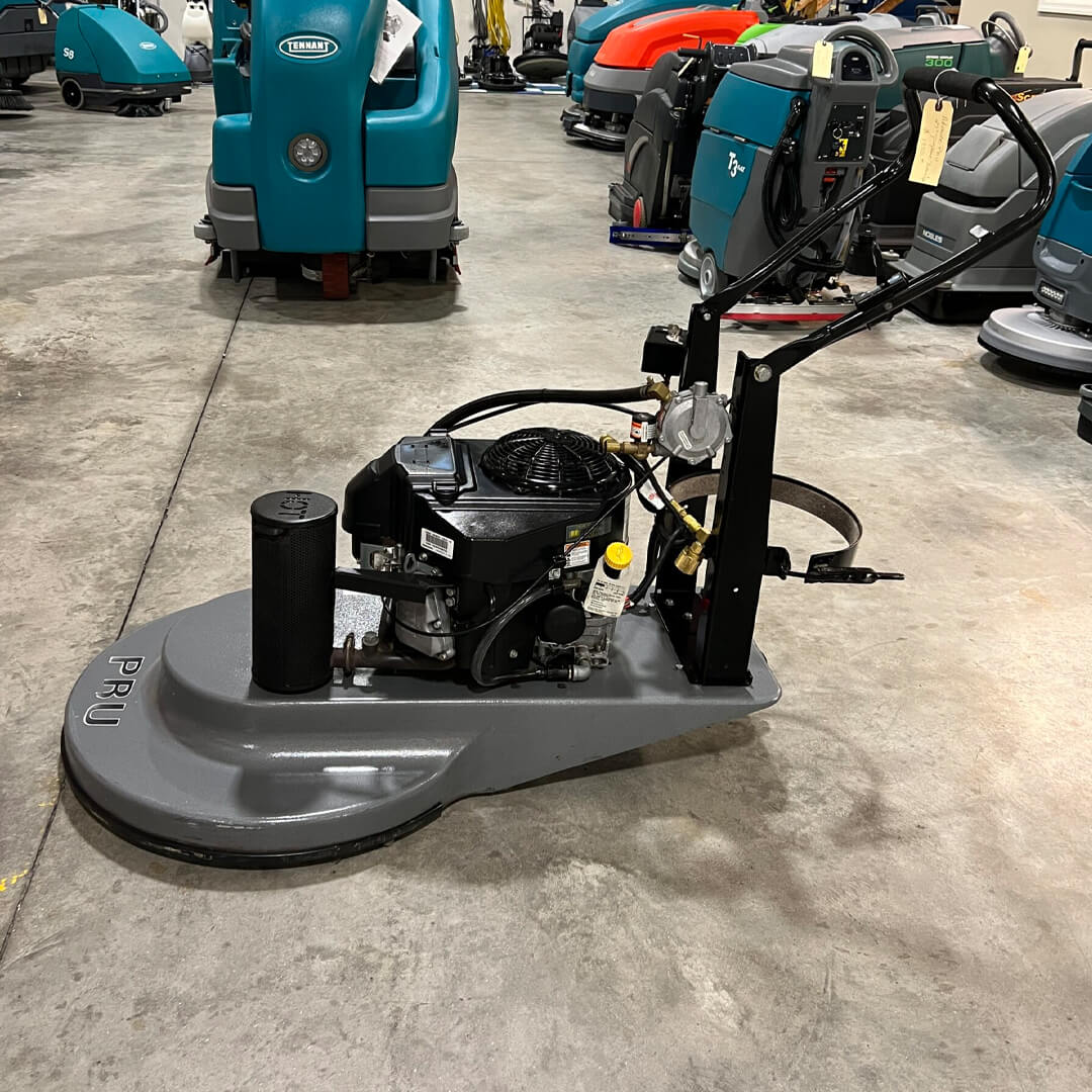 A floor cleaning machine in a warehouse.