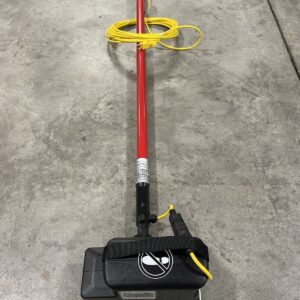 A black, red and yellow SquareScrub Doodle on a warehouse floor.