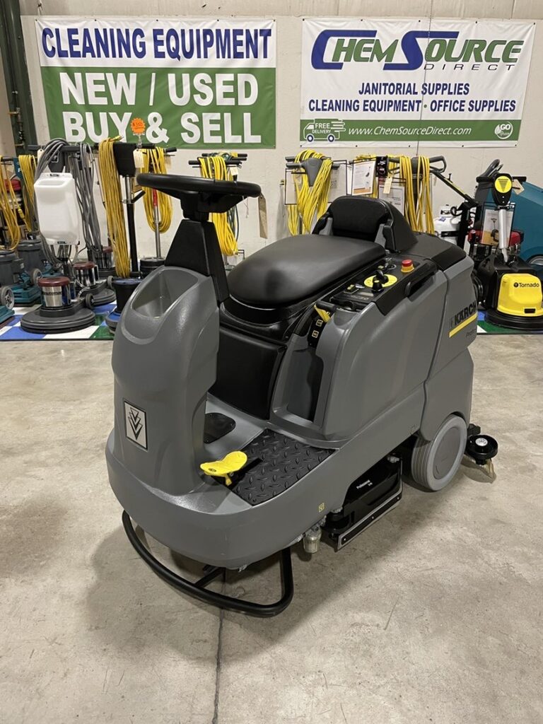 A Karcher B90R Rider Scrubber in a warehouse showroom.