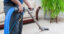 Man performing commercial carpet cleaning.