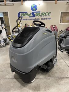 A Karcher Chariot 3 iVac 86/1 RS BP Stand-On Vacuum in a warehouse showroom.
