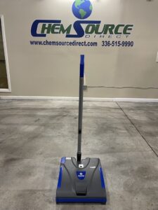 A Pacific SW16B Battery Powered Sweeper in a warehouse showroom.