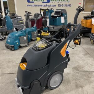 A Taski ProCarpet 30 Carpet Extractor in a warehouse showroom.