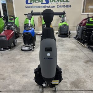 A CDeno Bot T-Clean X2 Hand-Held Scrubber Dryer in a warehouse showroom.