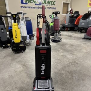 A Sanitaire EON SC5500B Upright Vacuum in a warehouse showroom.
