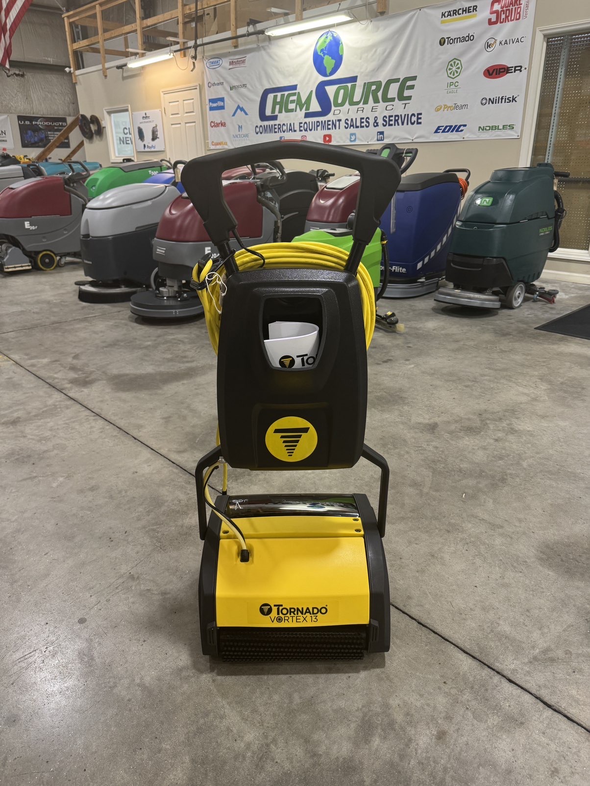 A Tornado Vortex 13 Multi-Surface Scrubber in a warehouse showroom.