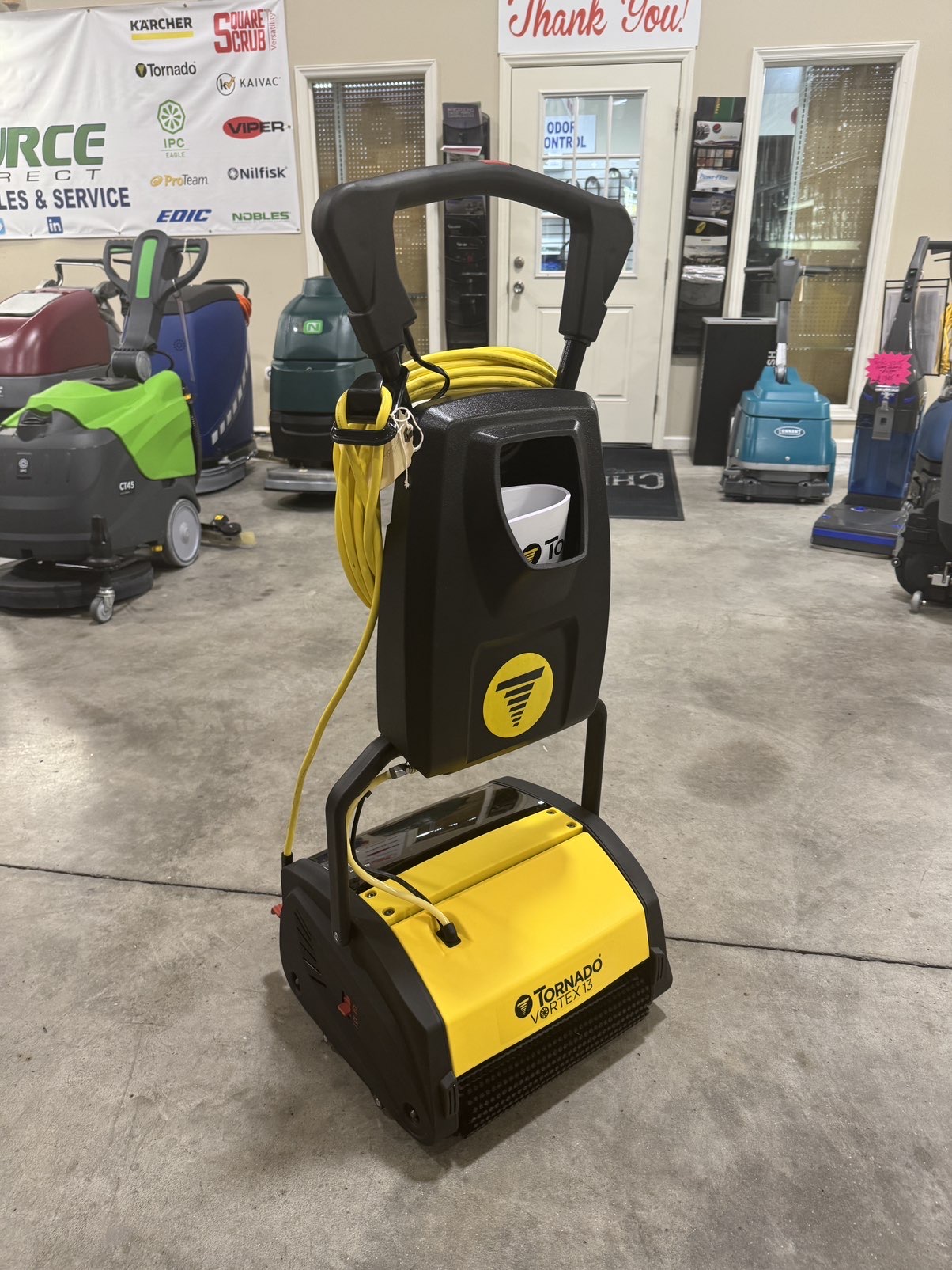 A Tornado Vortex 13 Multi-Surface Scrubber in a warehouse showroom.