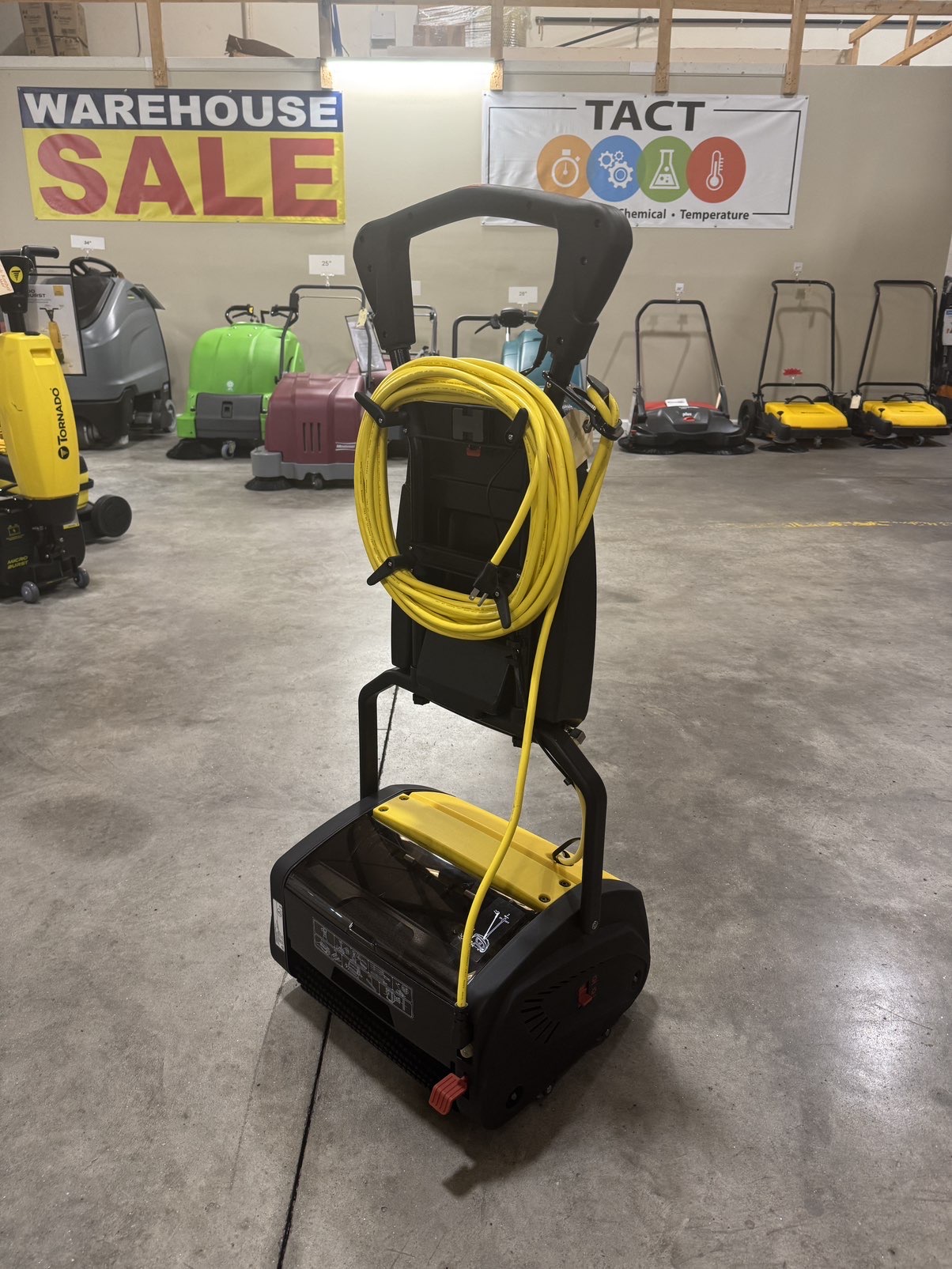 A Tornado Vortex 13 Multi-Surface Scrubber in a warehouse showroom.