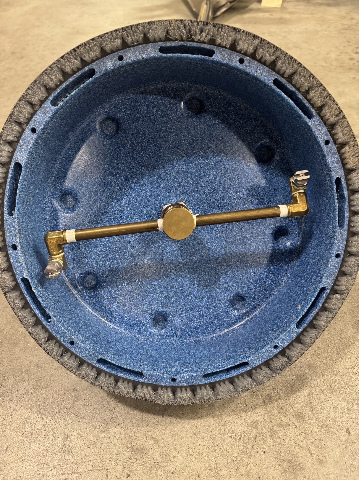 An EDIC Revolution Tile & Grout Tool in a warehouse showroom.