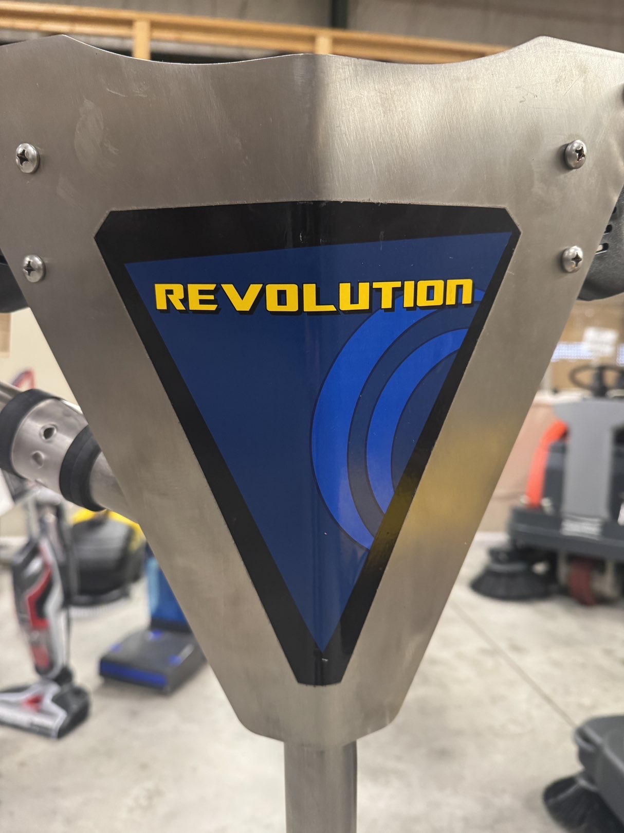 An EDIC Revolution Tile & Grout Tool in a warehouse showroom.
