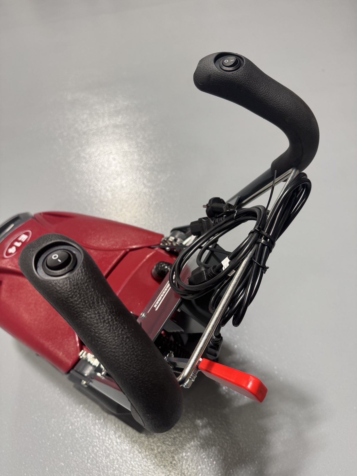 A Minuteman E14 Walk-Behind Scrubber in a warehouse showroom at ChemSource Direct.