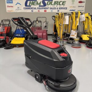 A Viper AS4325B 17" Walk-Behind Scrubber in a warehouse showroom at ChemSource Direct.