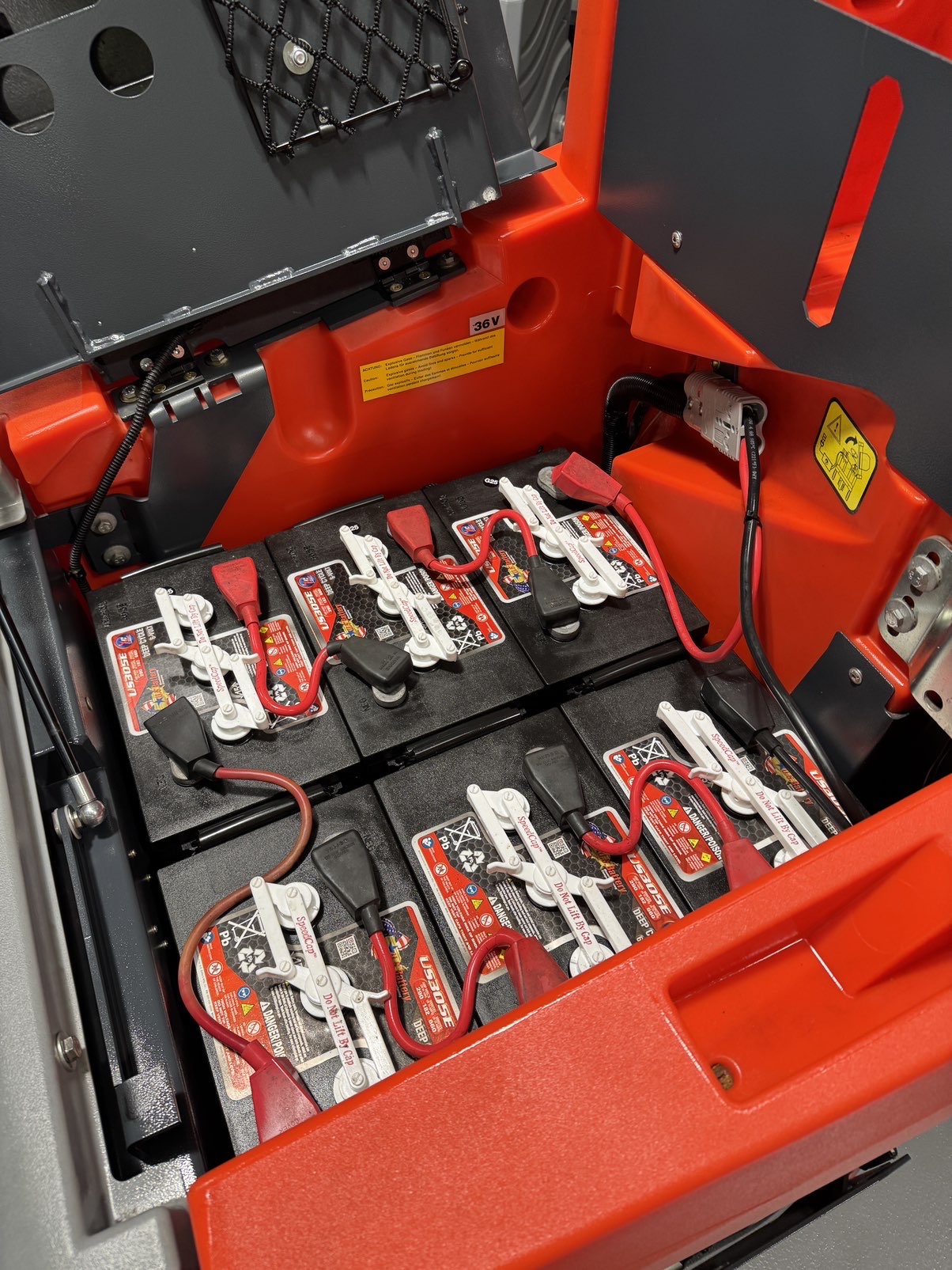 A PowerBoss Scrubmaster B175 Cylindrical Ride-On Scrubber in a warehouse showroom at ChemSource Direct.