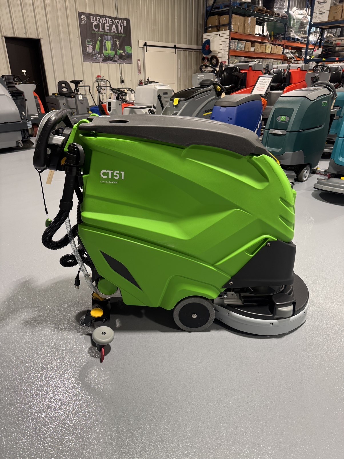 An IPC CT51 Walk-Behind Scrubber in a warehouse showroom at ChemSource Direct.
