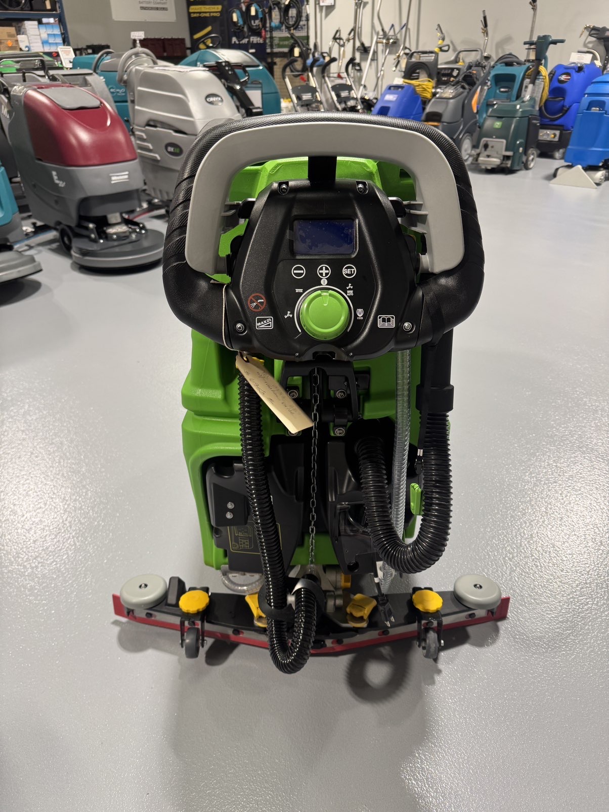 An IPC CT51 Walk-Behind Scrubber in a warehouse showroom at ChemSource Direct.