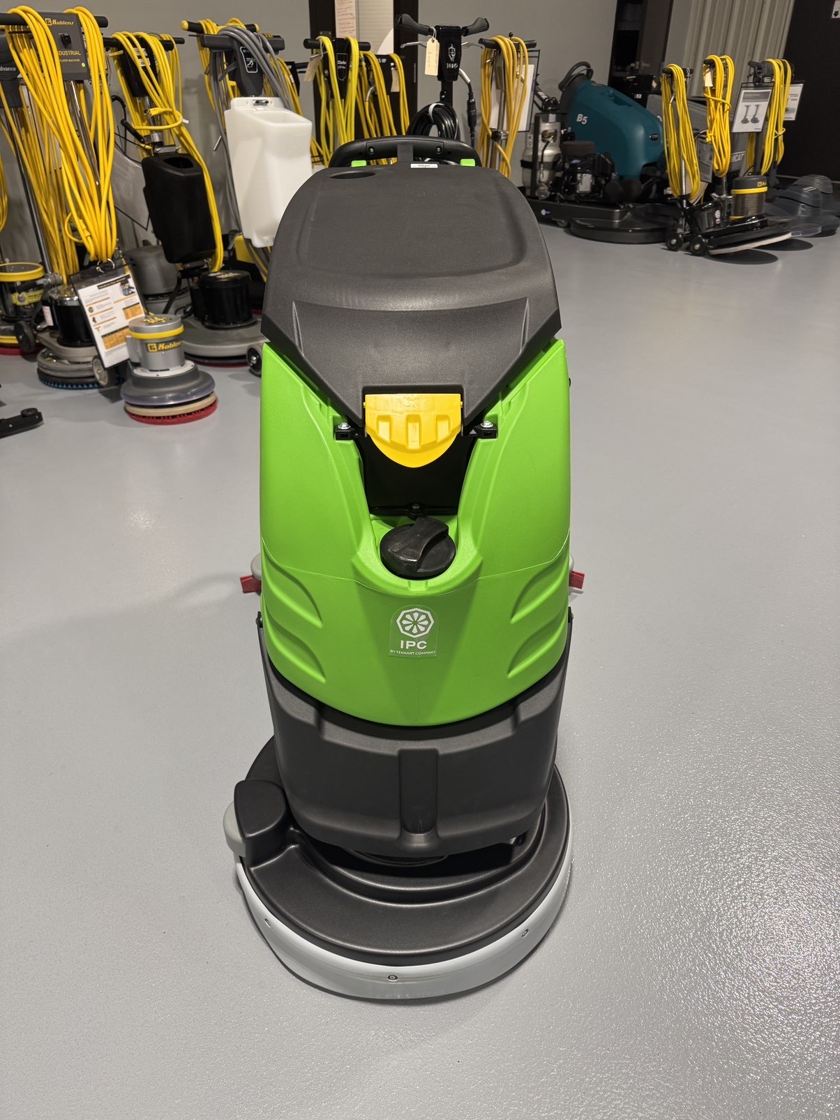 An IPC CT51 Walk-Behind Scrubber in a warehouse showroom at ChemSource Direct.