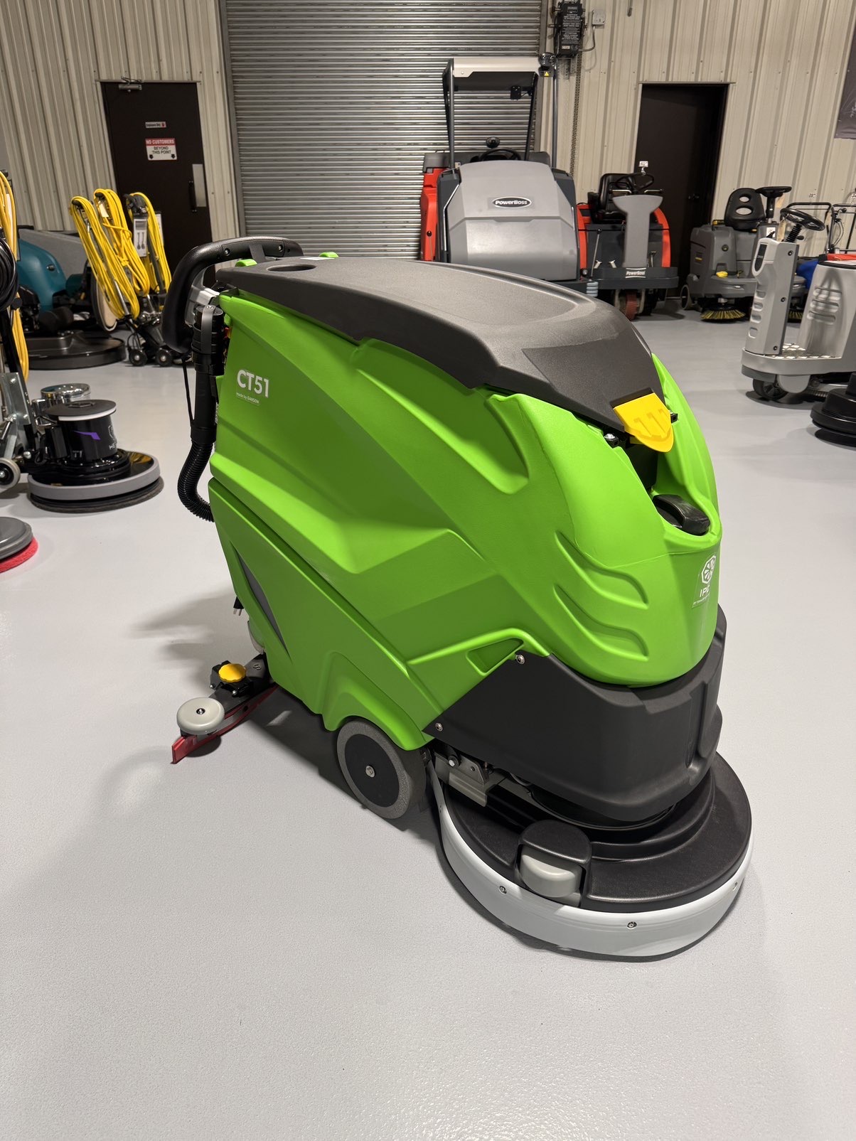 An IPC CT51 Walk-Behind Scrubber in a warehouse showroom at ChemSource Direct.