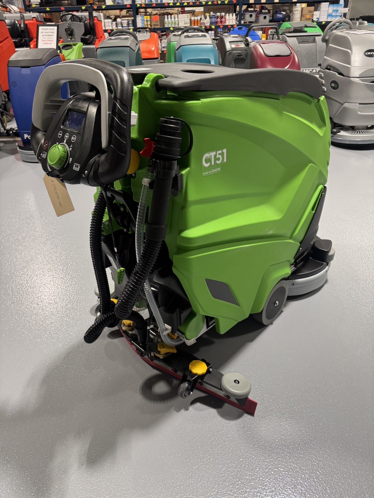 An IPC CT51 Walk-Behind Scrubber in a warehouse showroom at ChemSource Direct.