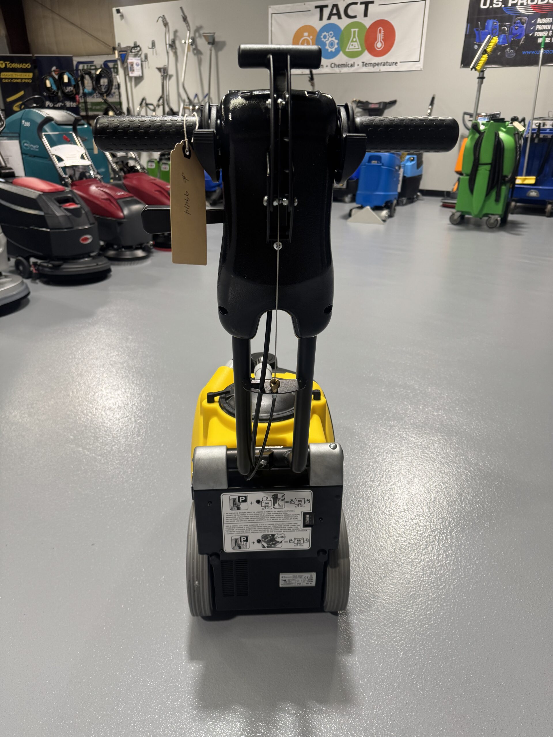 Tornado BD 14/4 14" Walk-Behind Scrubber in a warehouse showroom at ChemSource Direct.