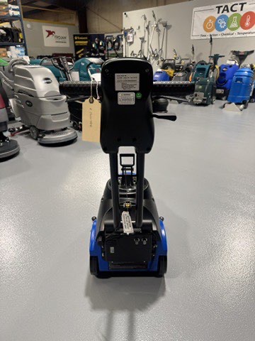 A Clarke MA50 15" Walk-Behind Scrubber in a warehouse showroom at ChemSource Direct.