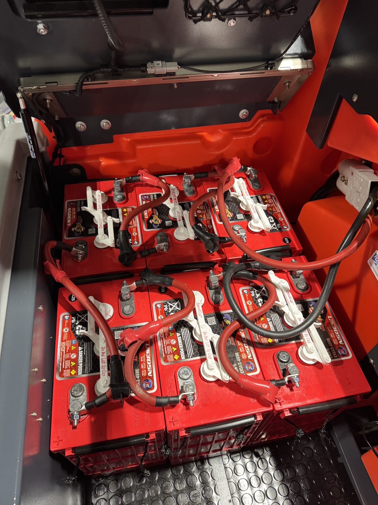 A Powerboss B260R Cylindrical Ride-On Scrubber in a warehouse showroom at ChemSource Direct.