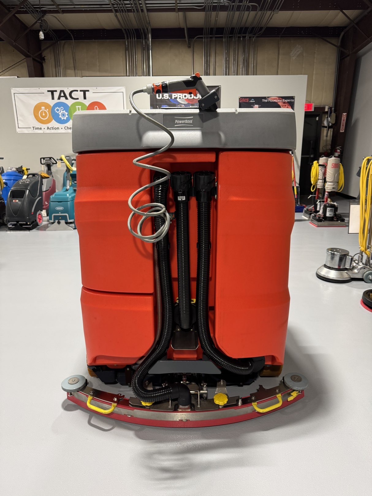 A Powerboss B260R Cylindrical Ride-On Scrubber in a warehouse showroom at ChemSource Direct.