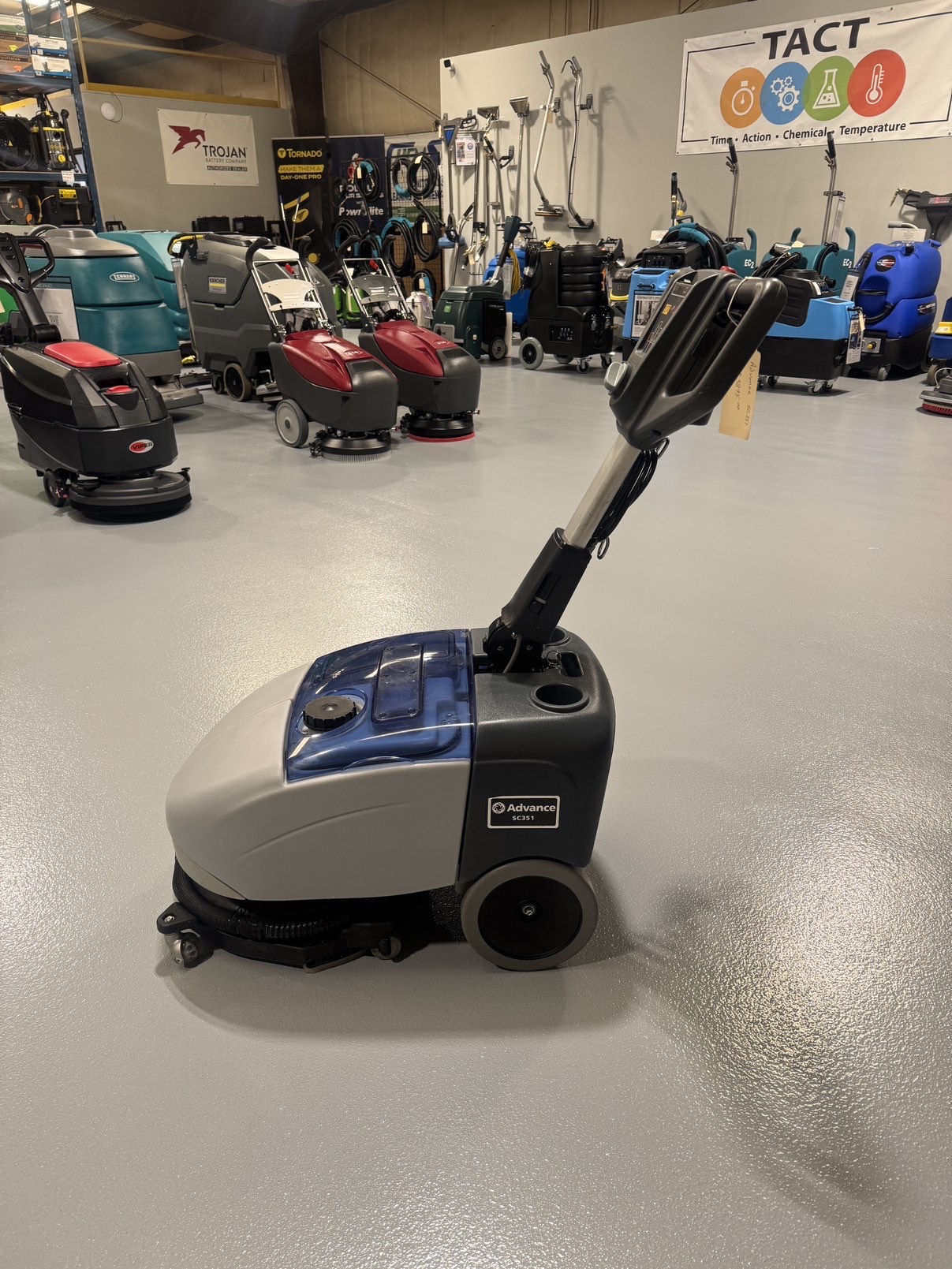 Advance SC351 Walk-Behind Scrubber in a warehouse showroom at ChemSource Direct.