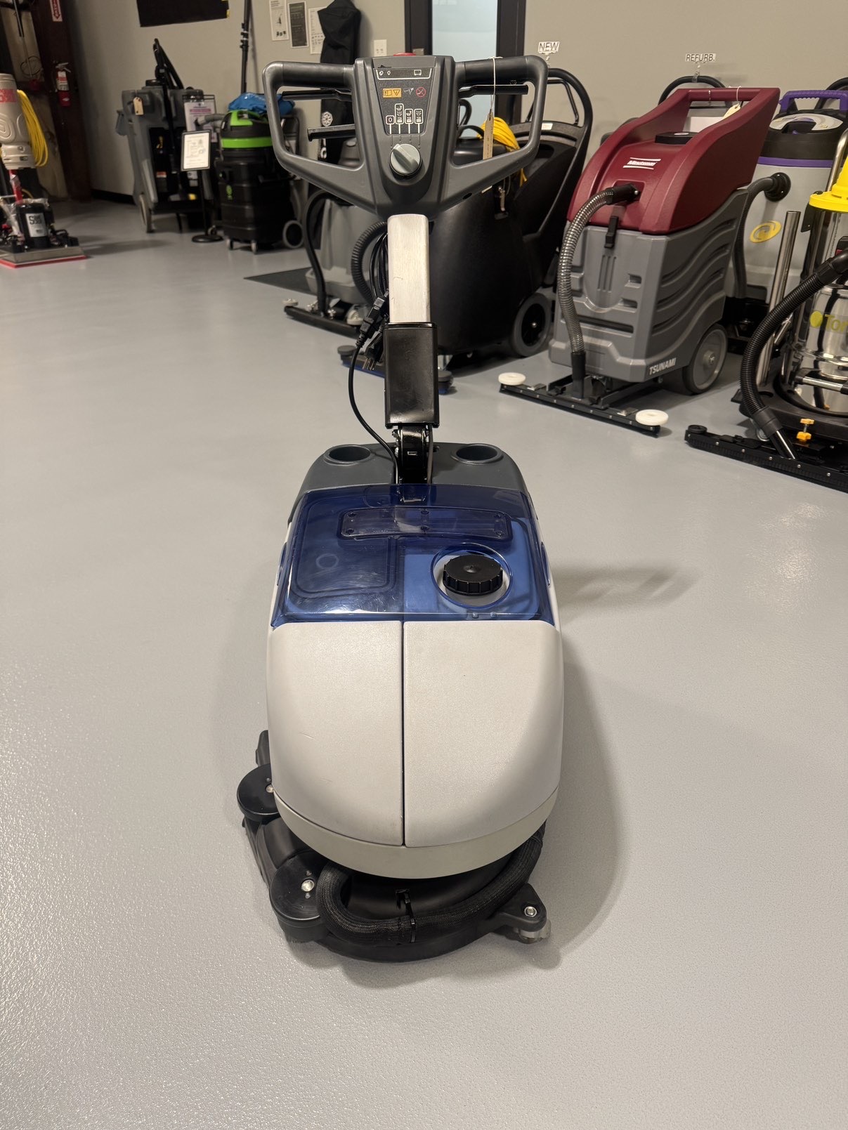 Advance SC351 Walk-Behind Scrubber in a warehouse showroom at ChemSource Direct.