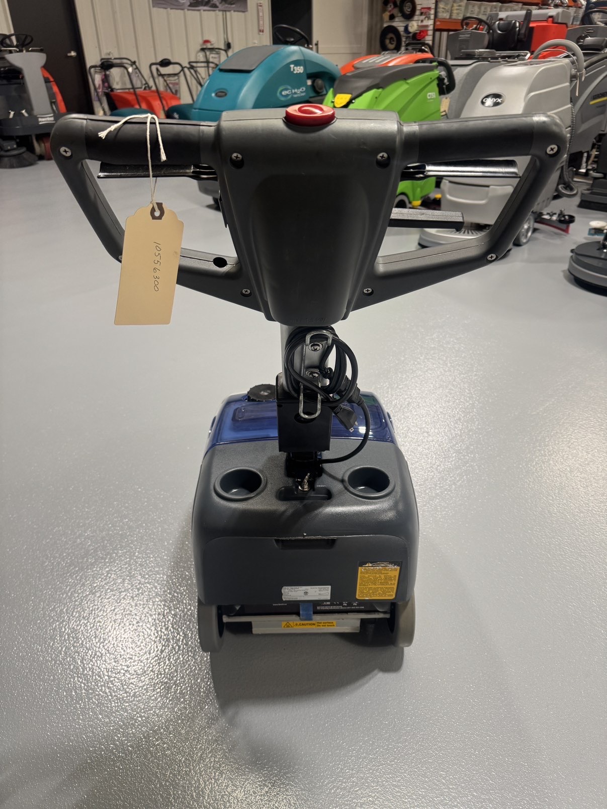 Advance SC351 Walk-Behind Scrubber in a warehouse showroom at ChemSource Direct.