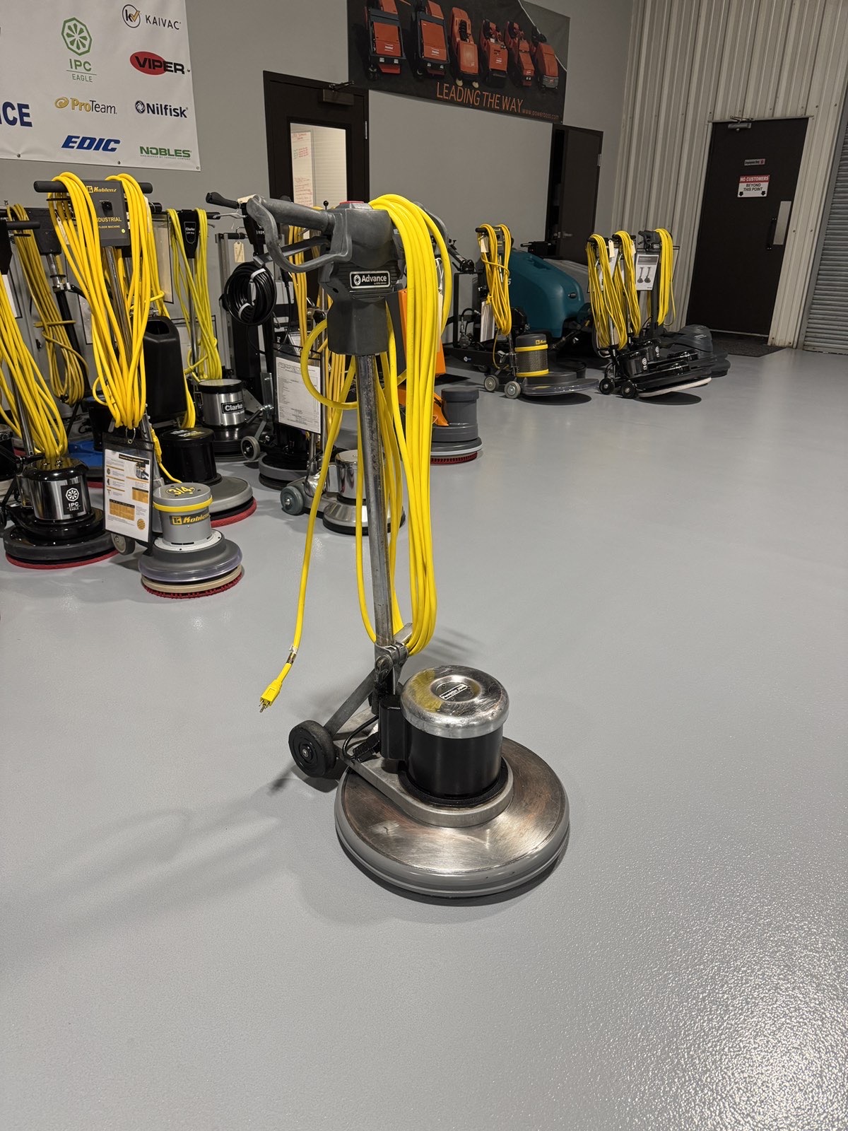An Advance Pacesetter 20 HD Low-Speed Scrubber in a warehouse showroom at ChemSource Direct.