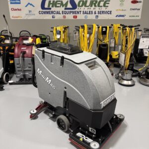A Tomcat MiniMag 28E Orbital Walk-Behind Scrubber in a warehouse showroom at ChemSource Direct.