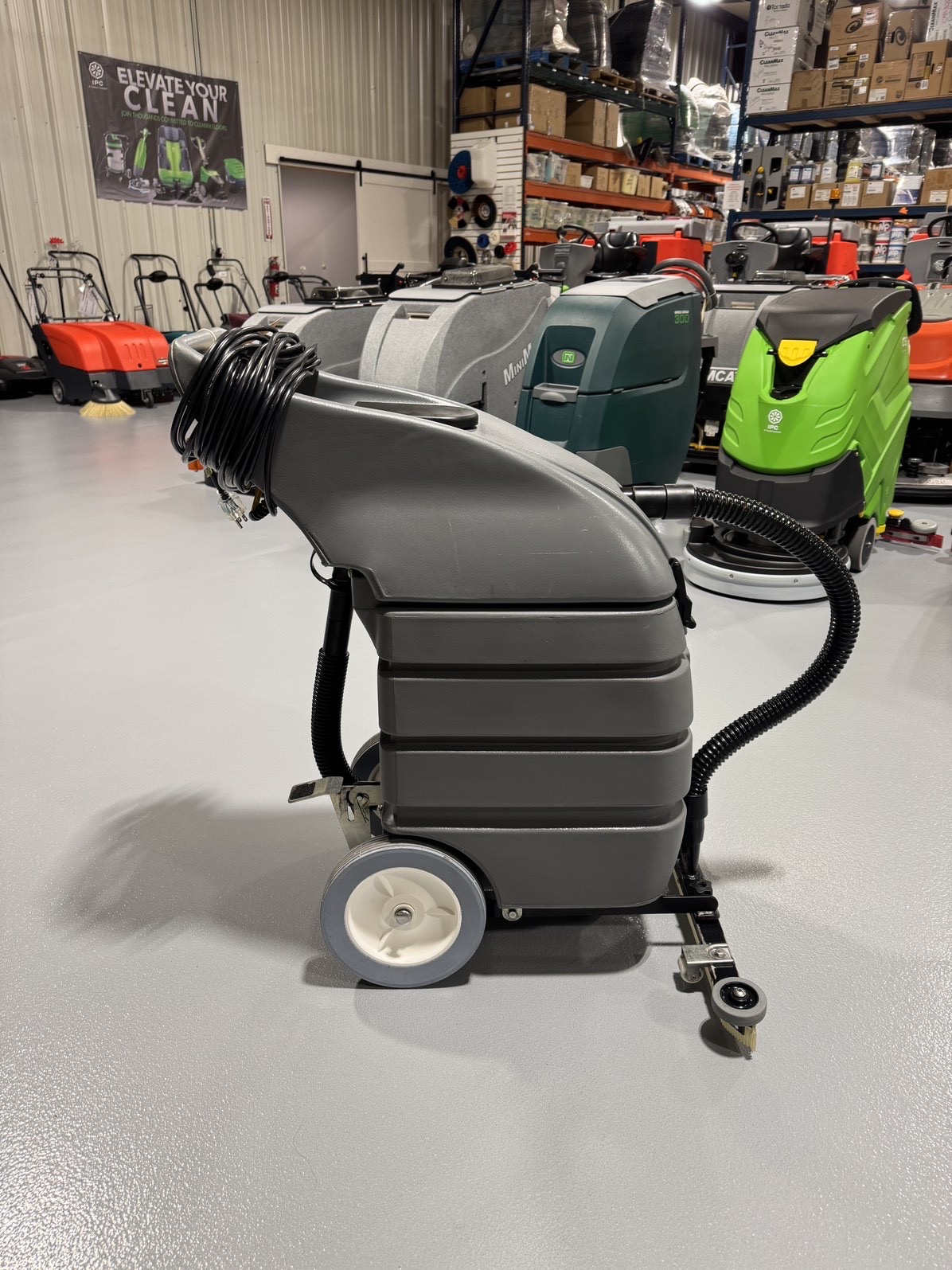 A Tennant V-WD-15 15 Gallon Wet/Dry Vacuum in a warehouse showroom at ChemSource Direct.
