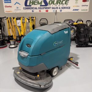 A Tennant T500 Walk-Behind Scrubber in a warehouse showroom at ChemSource Direct.