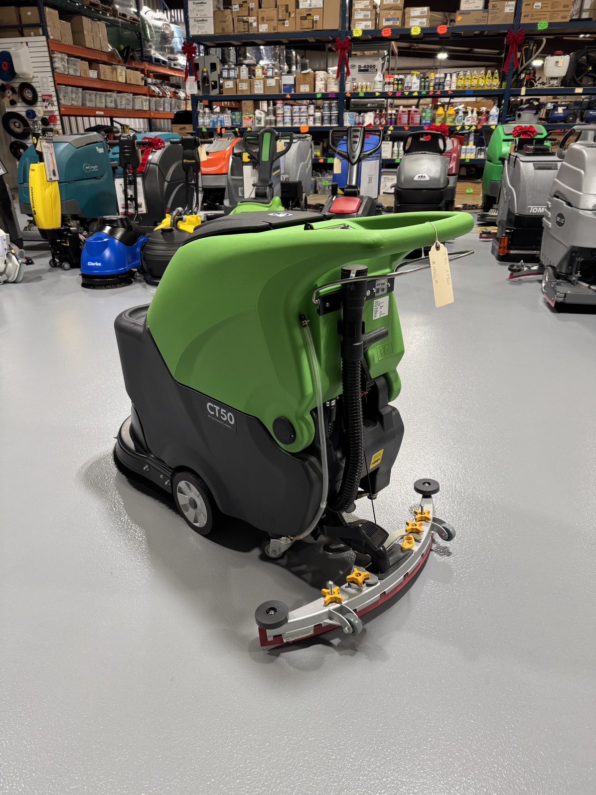 An IPC CT50 Walk-Behind Scrubber in a warehouse showroom at ChemSource Direct.