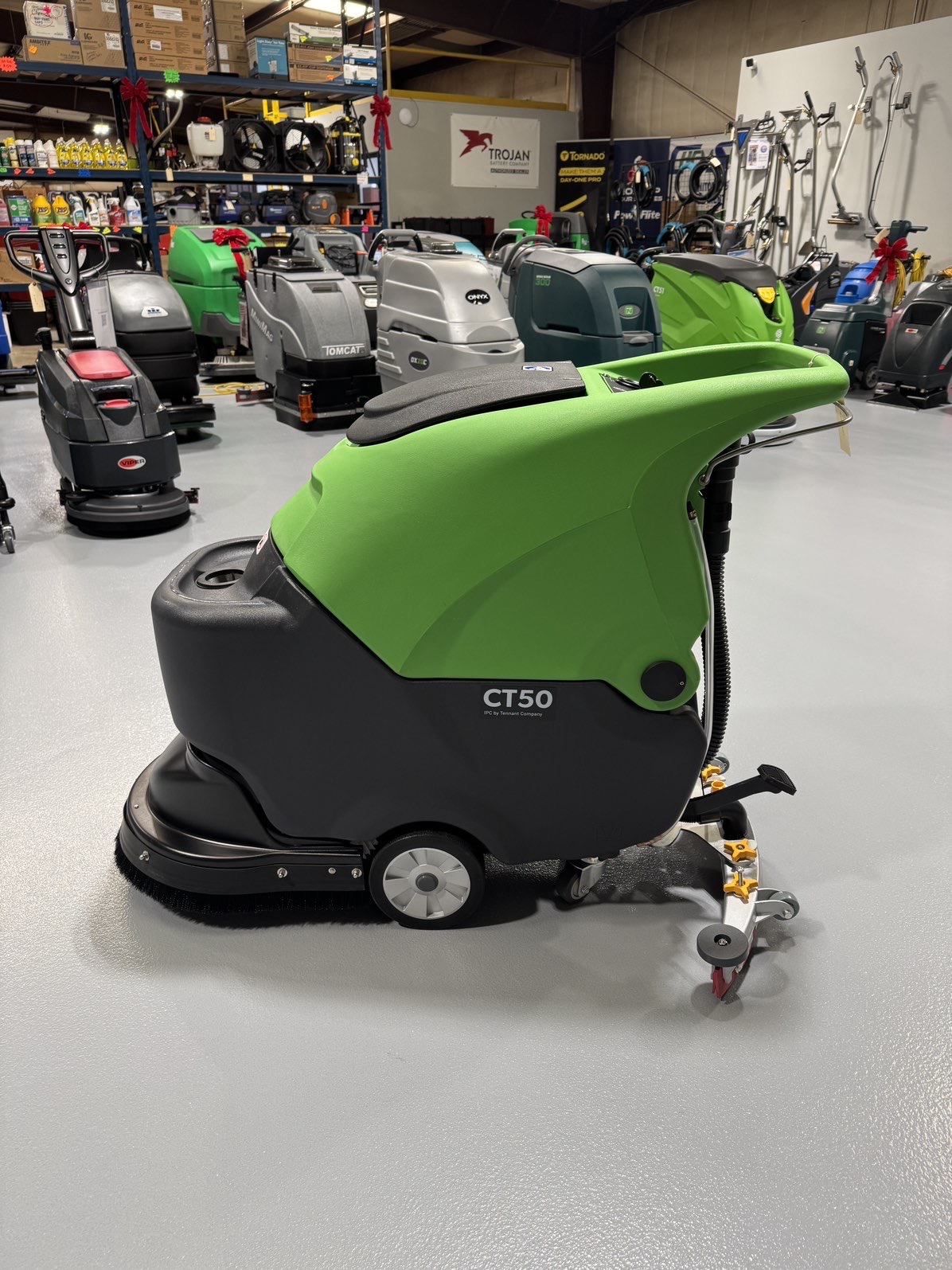 An IPC CT50 Walk-Behind Scrubber in a warehouse showroom at ChemSource Direct.
