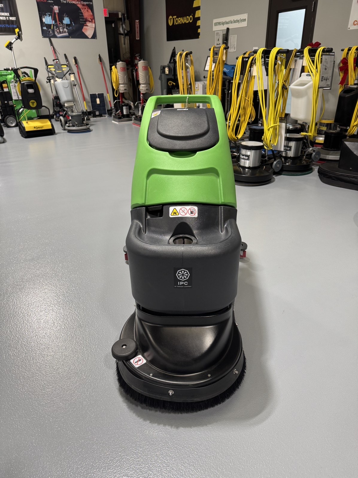 An IPC CT50 Walk-Behind Scrubber in a warehouse showroom at ChemSource Direct.