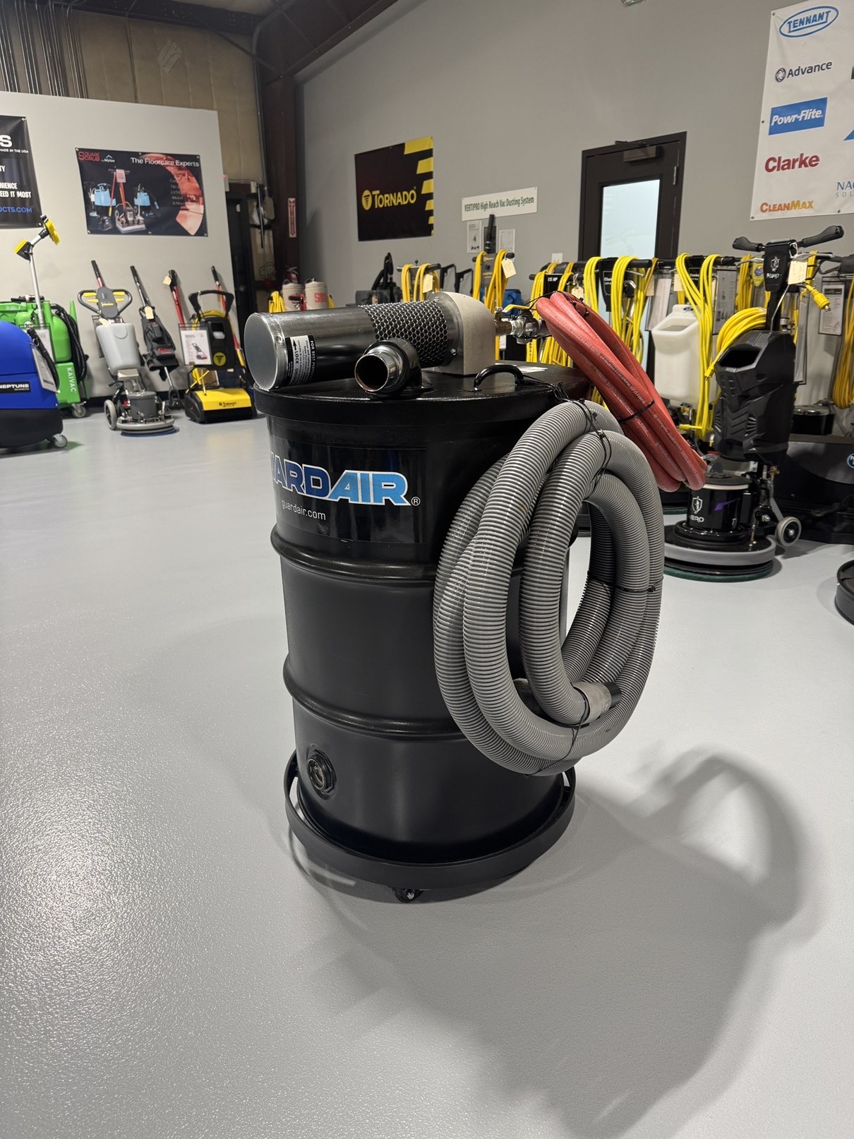 A Guardair Single Venturi 55 Gallon Wet/Dry Vac in a warehouse showroom at ChemSource Direct.
