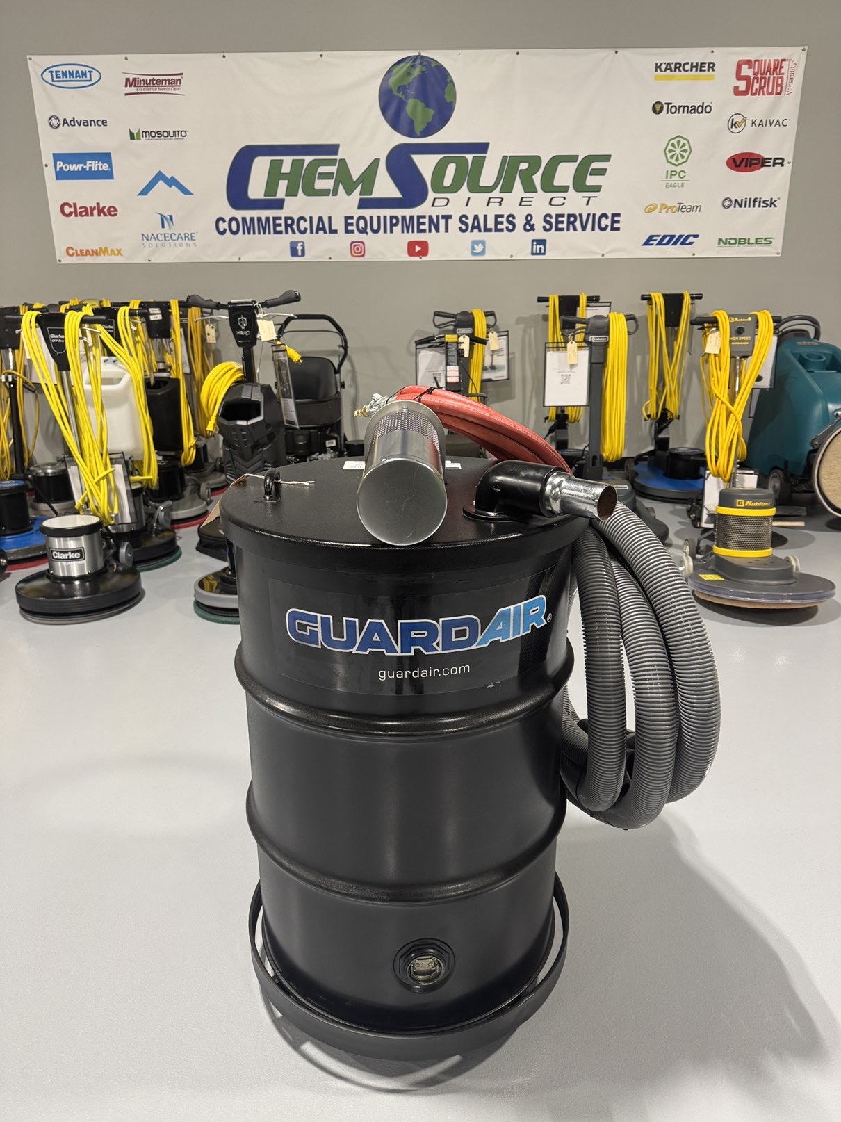 A Guardair Single Venturi 55 Gallon Wet/Dry Vac in a warehouse showroom at ChemSource Direct.