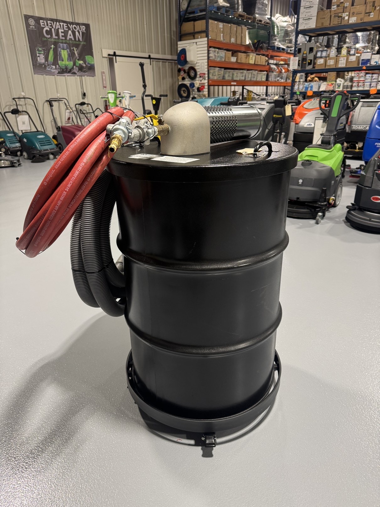 A Guardair Single Venturi 55 Gallon Wet/Dry Vac in a warehouse showroom at ChemSource Direct.