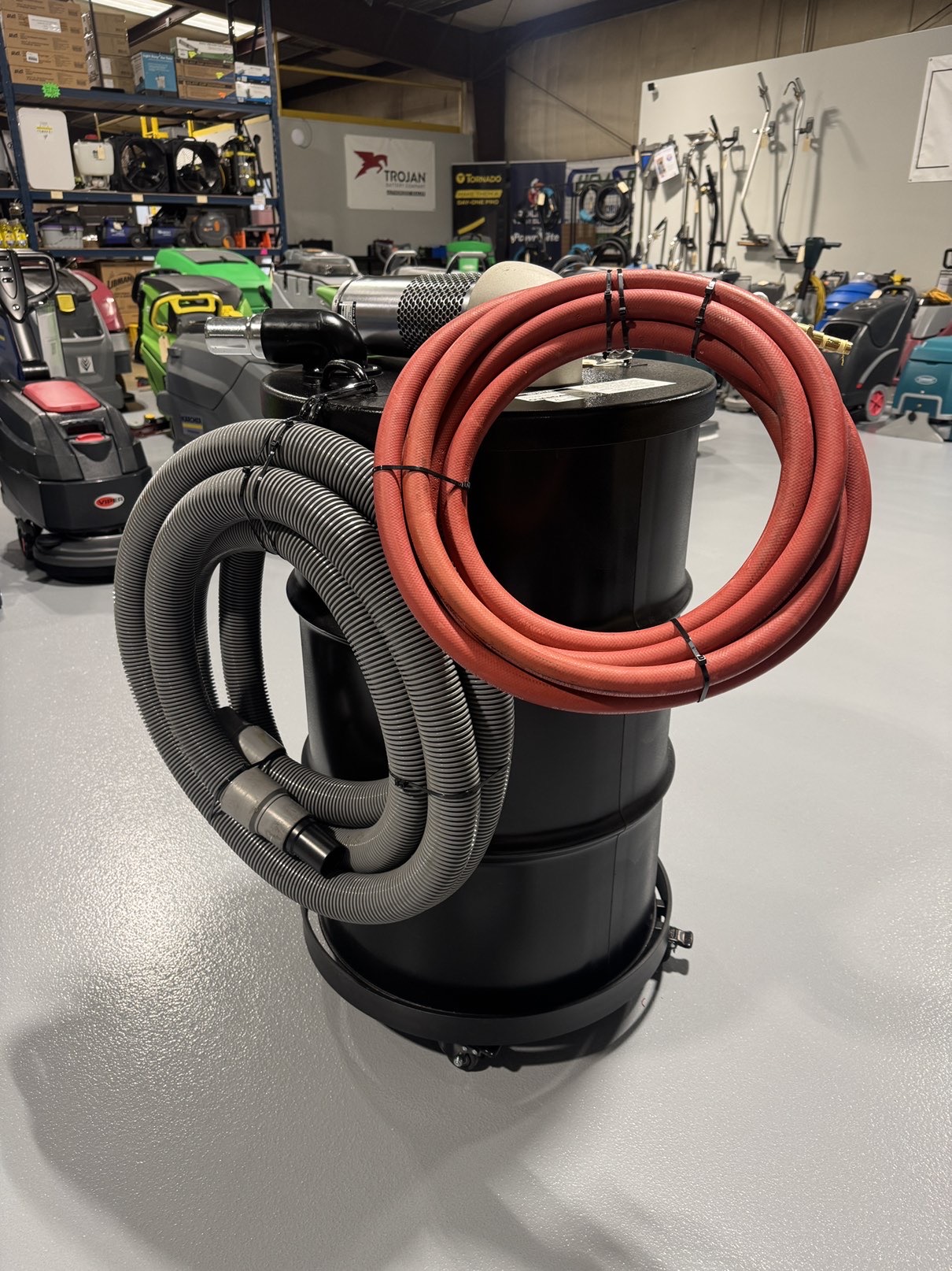 A Guardair Single Venturi 55 Gallon Wet/Dry Vac in a warehouse showroom at ChemSource Direct.