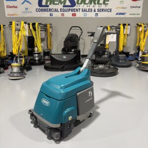 A Tennant Lithium Ion T1B Walk-Behind Micro-Scrubber in a warehouse showroom at ChemSource Direct.