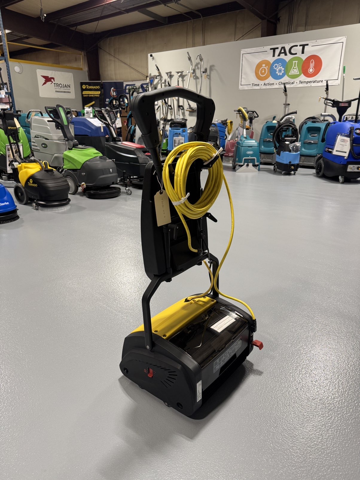A Tornado Vortex 13 Cylindrical Floor Scrubber in a warehouse showroom at ChemSource Direct.
