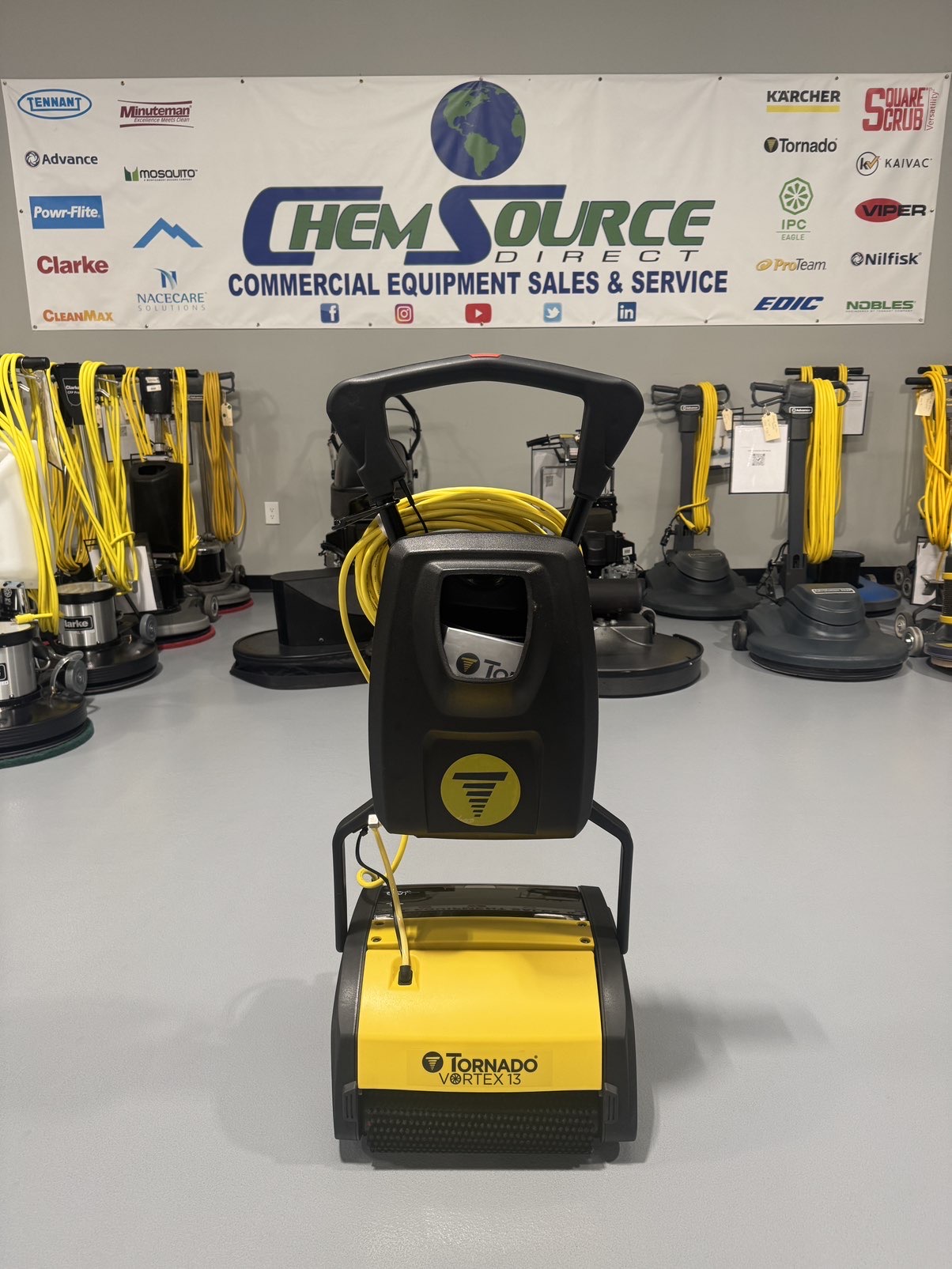 A Tornado Vortex 13 Cylindrical Floor Scrubber in a warehouse showroom at ChemSource Direct.