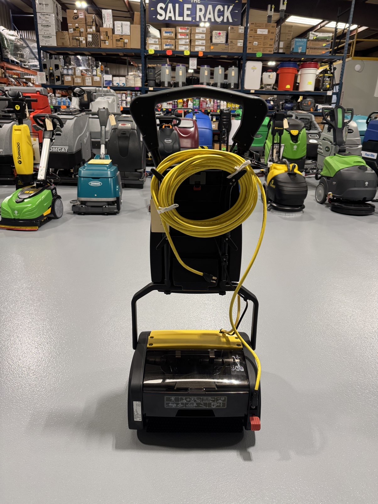A Tornado Vortex 13 Cylindrical Floor Scrubber in a warehouse showroom at ChemSource Direct.