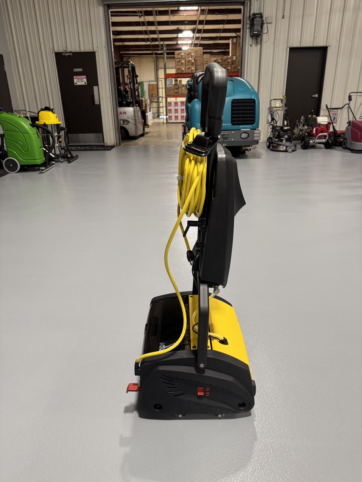 A Tornado Vortex 13 Cylindrical Floor Scrubber in a warehouse showroom at ChemSource Direct.